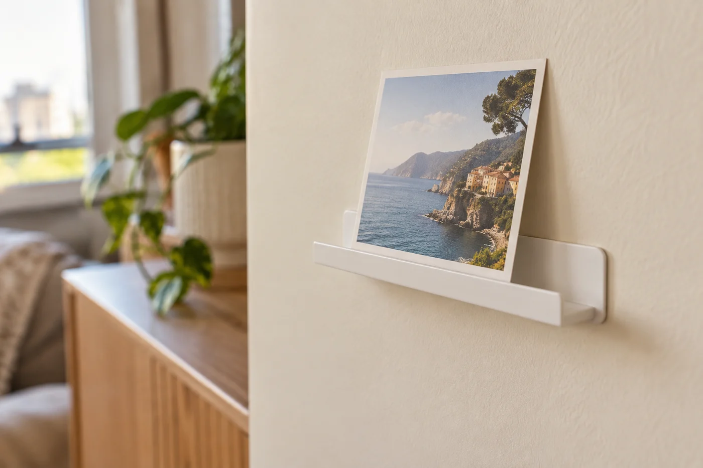 A small ledge supports a light decorative frame.